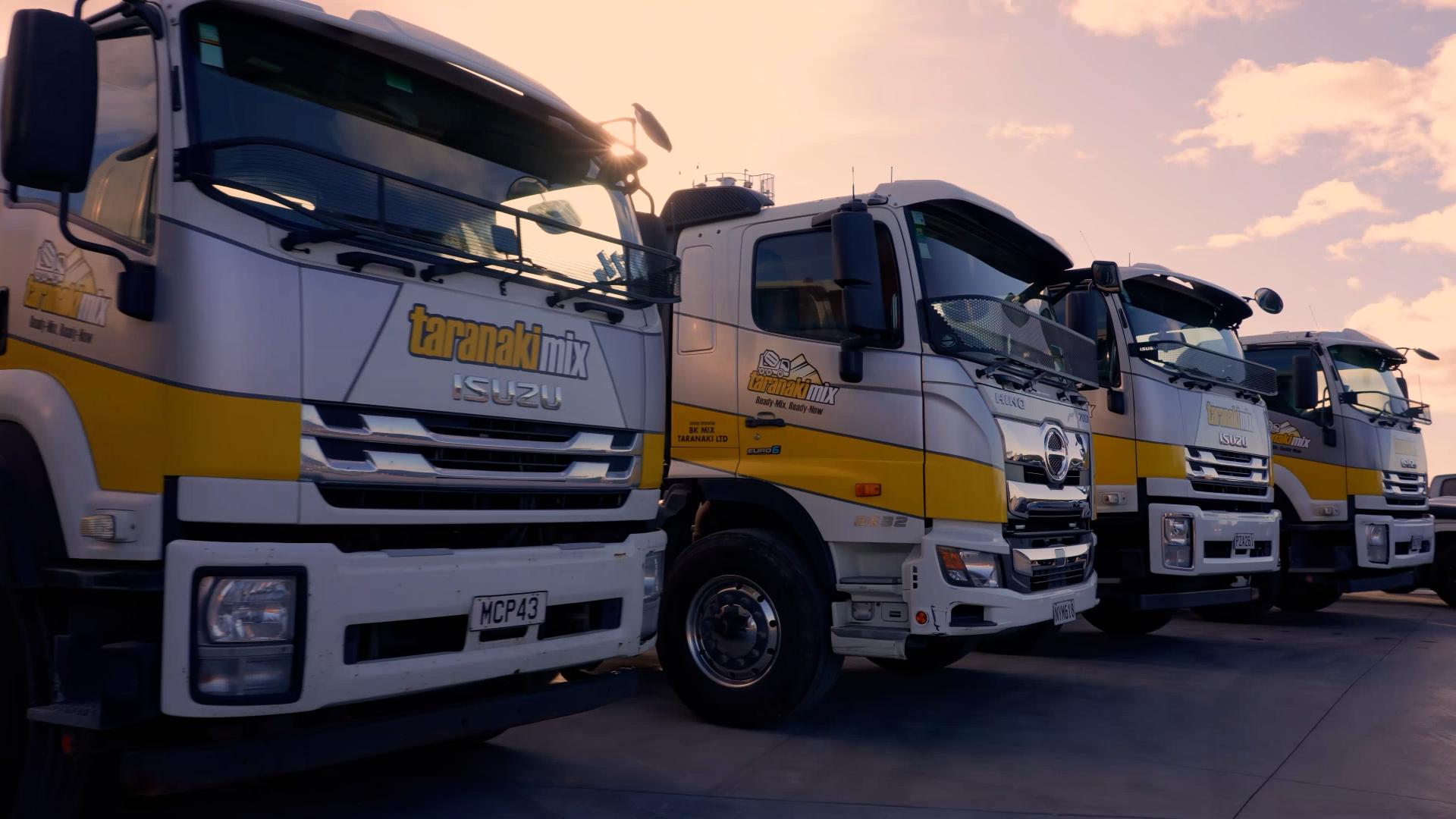 Concrete trucks in the sunset